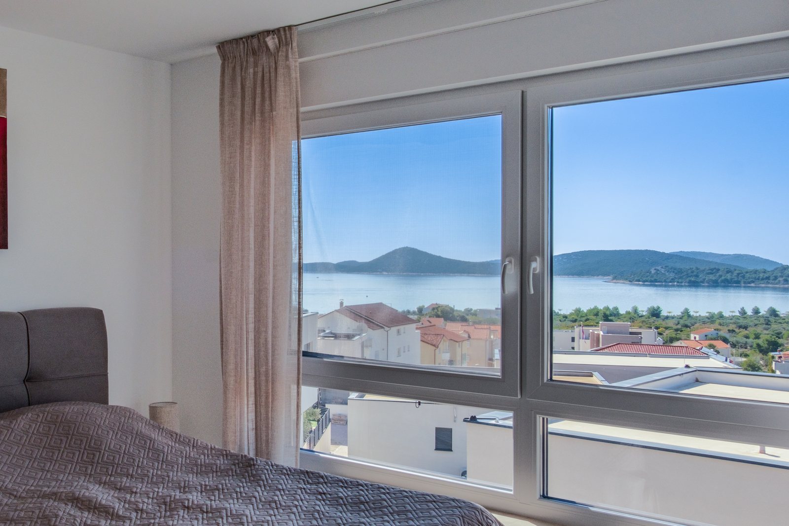 Bedroom 1, with a wide view of the sea and the islands