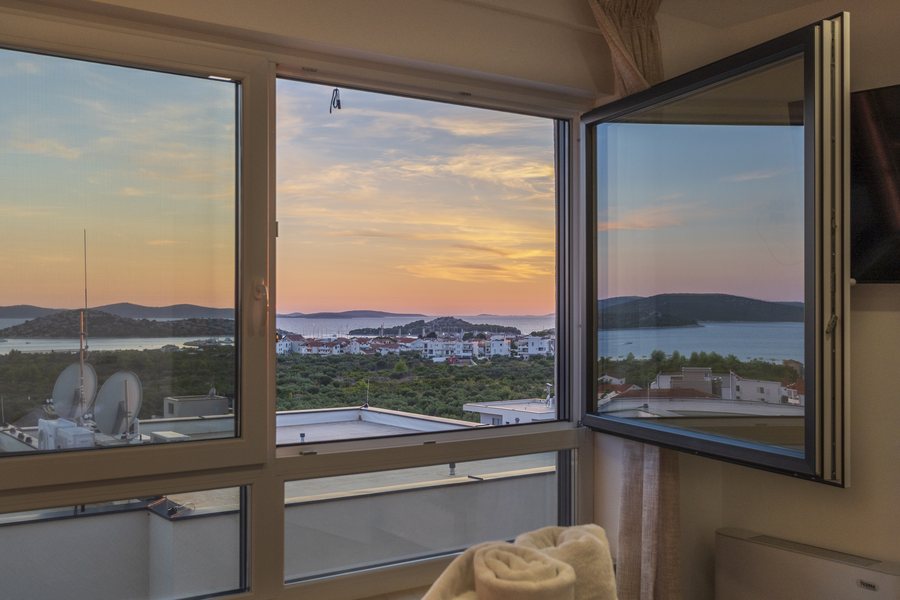 Sunset through the open window of bedroom 1