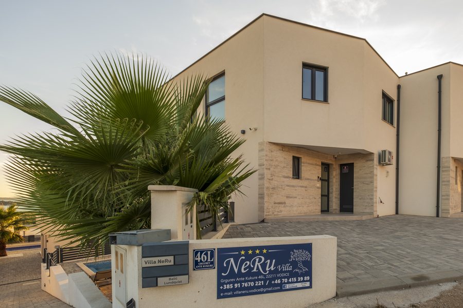 The entrance with the Villa NeRu sign