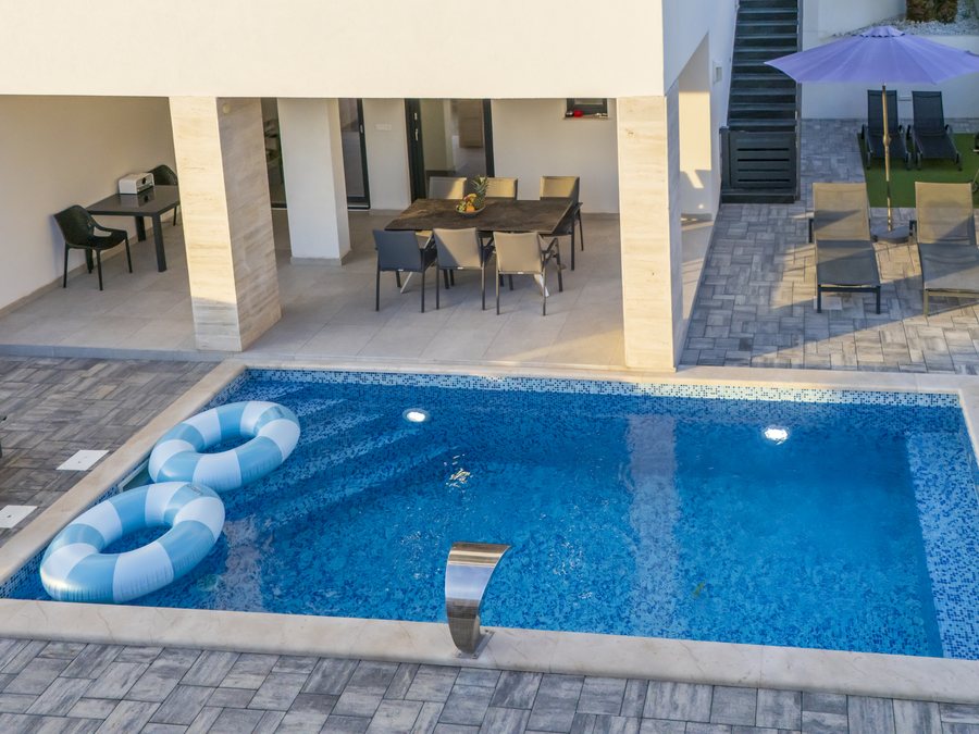 The pool and the covered dining area seen from above
