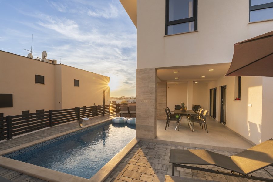 Late sun over the pool and the terrace