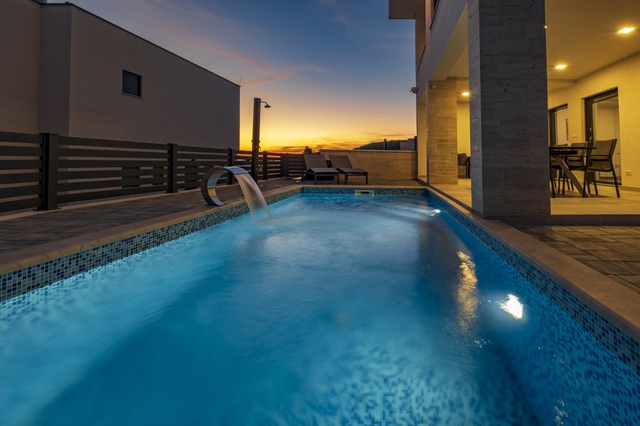 Pool lights on as the sun goes down