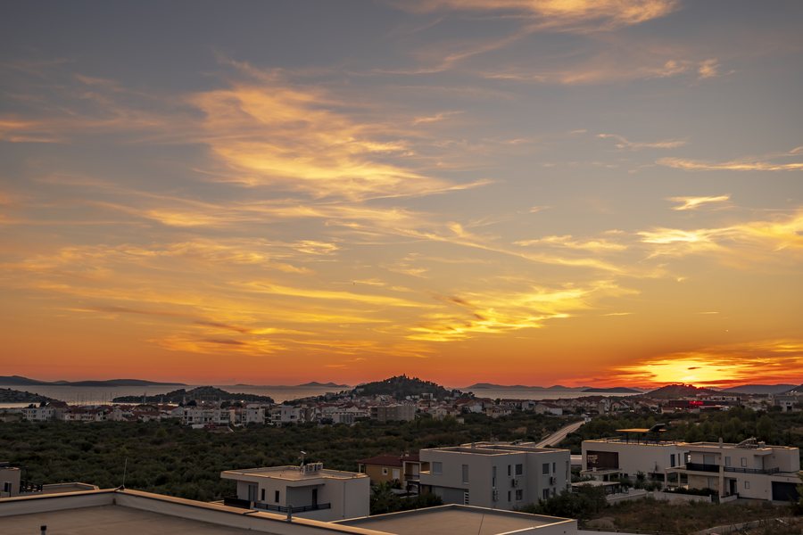 Sunset over the coast and the islands — the view from the bedrooms