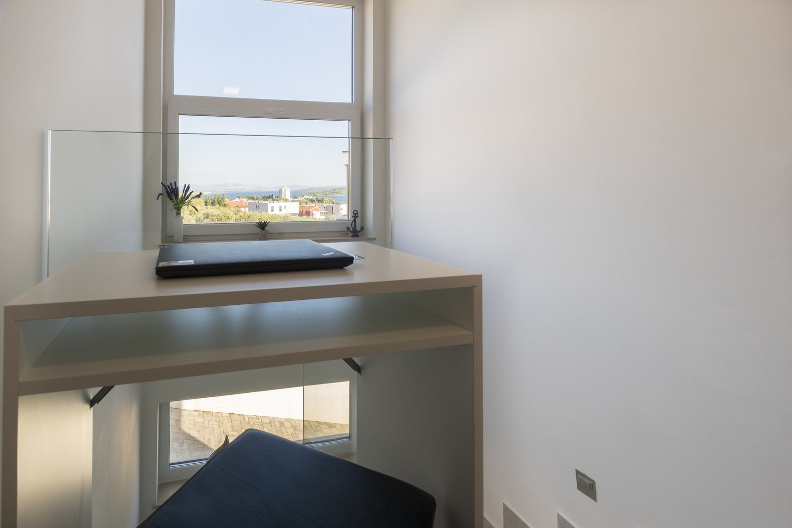 A work desk by the window, with a view out